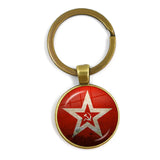 SLEUTELHANGER USSR WITTE STER HAMER EN SIKKEL VINTAGE BRONS