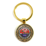 SLEUTELHANGER USSR WITTE STER HAMER EN SIKKEL VINTAGE BRONS