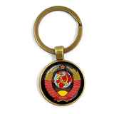 SLEUTELHANGER USSR WITTE STER HAMER EN SIKKEL VINTAGE BRONS