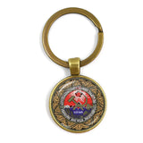 SLEUTELHANGER USSR WITTE STER HAMER EN SIKKEL VINTAGE BRONS