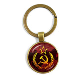 SLEUTELHANGER USSR WITTE STER HAMER EN SIKKEL VINTAGE BRONS