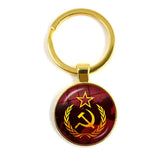 SLEUTELHANGER USSR WITTE STER HAMER EN SIKKEL VINTAGE BRONS