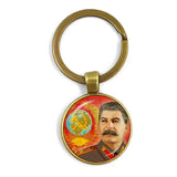 SLEUTELHANGER USSR WITTE STER HAMER EN SIKKEL VINTAGE BRONS